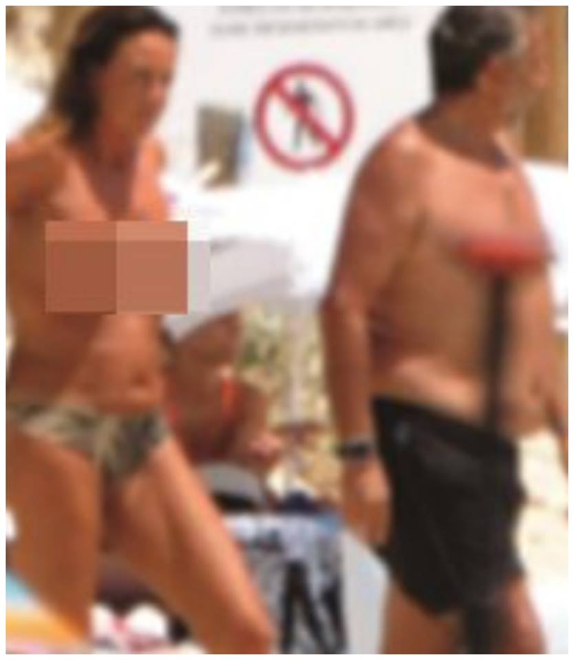 TRAVOLTA DALLE POLEMICHE, MA LEI DIMENTICA TUTTO E SI MOSTRA IN TOPLESS CON LUI: COSI' INFIAMMA L'ESTATE ITALIANA - 18/07/2017