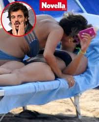 AMBRA E I 'BACI HOT' CON UNA DONNA IN SPIAGGIA - FOTO ALL'INTERNO - 31/07/2013